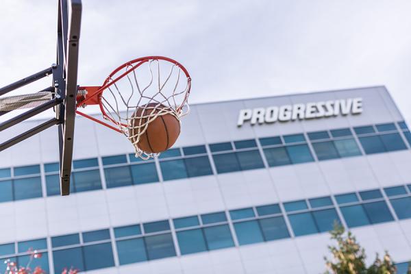 Basketball going through hoop outside of Progressive building